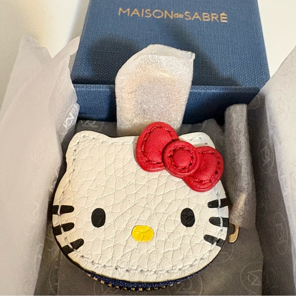 MAISON de SABRÉ The SABRÉMOJI Leather Hello Kitty Bag Charm Air Tag holder